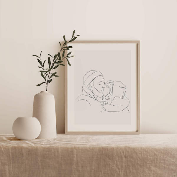 Disegno Line Art di una coppia, posizionato in una cornice su un tavolo accanto a una pianta